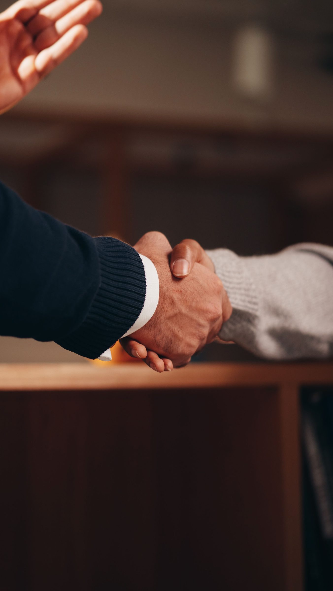 Two people shaking hands.